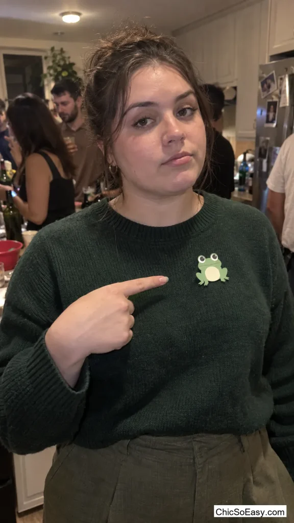 Green Sweater With a Paper Frog